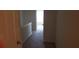 Hallway with carpet, white walls and doors; natural light filtering through at 2102 Executive Dr, Duluth, GA 30096