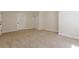 Spacious bedroom with neutral carpet, doors, and trim provides a blank canvas for personalization at 7085 Wakehurst Pl, Cumming, GA 30040