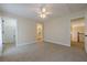 Bedroom with carpet and two doors with access to ensuite bath and walk-in closet at 7085 Wakehurst Pl, Cumming, GA 30040
