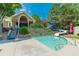Community pool with a waterslide and lounging area, providing residents with a fun and relaxing recreational space at 7085 Wakehurst Pl, Cumming, GA 30040