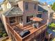 Upper level deck with an outdoor table, chairs, and grill at 7085 Wakehurst Pl, Cumming, GA 30040