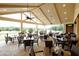 Covered dining patio with views of the golf course at 7085 Wakehurst Pl, Cumming, GA 30040
