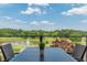 Beautiful community view from the outdoor patio overlooking the lake and golf course at 7085 Wakehurst Pl, Cumming, GA 30040