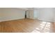 Bright and airy living area with hardwood floors and multiple entryways at 7085 Wakehurst Pl, Cumming, GA 30040