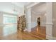 Spacious living room with cathedral ceiling, hardwood floors, and large windows at 7085 Wakehurst Pl, Cumming, GA 30040