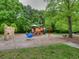 Community playground with slides, climbing structures, and playground equipment at 7085 Wakehurst Pl, Cumming, GA 30040