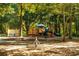 A view of a community playground with climbing structures and play equipment at 7085 Wakehurst Pl, Cumming, GA 30040