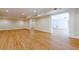 Spacious room with laminate flooring, recessed lighting, and a open floorplan at 7085 Wakehurst Pl, Cumming, GA 30040