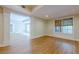 Inviting room with laminate flooring, providing an open and airy feel for versatile use at 7085 Wakehurst Pl, Cumming, GA 30040