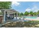 Community pool with an open air pavilion, sun loungers, and a splash pad with plenty of room to relax and play at 7085 Wakehurst Pl, Cumming, GA 30040