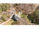 Aerial view featuring a home with pool surrounded by mature trees and a long private driveway at 129 Euharlee 5 Forks Rd, Euharlee, GA 30145