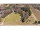 Aerial shot showcasing the expansive property, surrounded by lush greenery and a private driveway at 129 Euharlee 5 Forks Rd, Euharlee, GA 30145