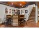 Finished basement with a bar area, kitchenette, wood ceiling, and stairs at 129 Euharlee 5 Forks Rd, Euharlee, GA 30145