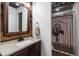 Charming bathroom with rustic wood accents, granite countertop, and decorative shower curtain at 129 Euharlee 5 Forks Rd, Euharlee, GA 30145