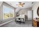 Cozy bedroom featuring a ceiling fan, a large window, and neutral walls at 129 Euharlee 5 Forks Rd, Euharlee, GA 30145