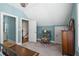 Bedroom with blue walls, neutral carpeting, and classic furniture at 129 Euharlee 5 Forks Rd, Euharlee, GA 30145