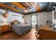 Comfortable bedroom with hardwood floors, natural light, and vintage-inspired decor at 129 Euharlee 5 Forks Rd, Euharlee, GA 30145