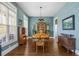 Dining room features a stylish chandelier and ample natural light at 129 Euharlee 5 Forks Rd, Euharlee, GA 30145
