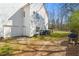 Home exterior view showing a white siding, a two-car garage, and a fenced-in yard at 129 Euharlee 5 Forks Rd, Euharlee, GA 30145