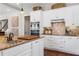 Kitchen featuring white cabinets, stainless steel appliances, and granite countertops at 129 Euharlee 5 Forks Rd, Euharlee, GA 30145