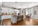Stylish kitchen with a central island, pendant lighting, white cabinets, and stainless steel appliances at 129 Euharlee 5 Forks Rd, Euharlee, GA 30145