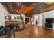 Spacious living room featuring wood accents, a built-in entertainment center, and modern furnishings at 129 Euharlee 5 Forks Rd, Euharlee, GA 30145