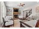 Cozy living room with fireplace, built-in shelving, hardwood floors, and seamless flow to the staircase at 129 Euharlee 5 Forks Rd, Euharlee, GA 30145