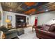 Spacious living area with a wood ceiling, plush seating, and entertainment center at 129 Euharlee 5 Forks Rd, Euharlee, GA 30145