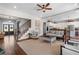Open-concept living room with hardwood floors, staircase, neutral tones, and an abundance of natural light at 129 Euharlee 5 Forks Rd, Euharlee, GA 30145