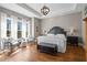 Main bedroom with tray ceiling, natural light, and decorative furniture at 129 Euharlee 5 Forks Rd, Euharlee, GA 30145