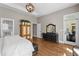Spacious main bedroom featuring hardwood floors, access to the porch, and neutral walls at 129 Euharlee 5 Forks Rd, Euharlee, GA 30145