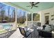 Charming covered patio with ceiling fan and comfortable seating overlooking the backyard and pool at 129 Euharlee 5 Forks Rd, Euharlee, GA 30145