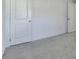 Clean and bright bedroom area with neutral carpet and doors for closets at 2054 Hickman Walk, Suwanee, GA 30024