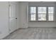 This bedroom offers a serene space with lots of windows and natural light, for relaxation at 2054 Hickman Walk, Suwanee, GA 30024