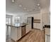 Open kitchen layout featuring a large island, stainless steel appliances and granite counters at 2054 Hickman Walk, Suwanee, GA 30024