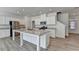 Well-lit kitchen with granite counters and stainless steel appliances at 2054 Hickman Walk, Suwanee, GA 30024