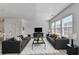 Sun-filled living room with two sofas, large windows and modern decor at 2054 Hickman Walk, Suwanee, GA 30024