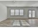 Bright and spacious living room features natural light and wood-look flooring at 2054 Hickman Walk, Suwanee, GA 30024