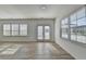 Airy living room with wood floors, windows and patio door at 2054 Hickman Walk, Suwanee, GA 30024