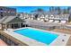 Large community pool surrounded by modern townhouses, ideal for summer recreation at 2054 Hickman Walk, Suwanee, GA 30024