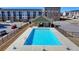 Resort-style community pool area with modern amenities and townhouses in the background at 2054 Hickman Walk, Suwanee, GA 30024