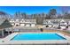 Community pool surrounded by modern townhomes, perfect for relaxing and socializing at 2054 Hickman Walk, Suwanee, GA 30024