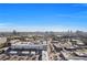 Expansive aerial view showcasing the cityscape and community, set against a clear blue sky backdrop at 4561 Olde Perimeter Way # 702, Atlanta, GA 30346
