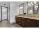 Spacious bathroom with a walk-in closet, double sink vanity and large mirrors at 4561 Olde Perimeter Way # 702, Atlanta, GA 30346