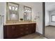 Bathroom features double sinks, granite counters, large mirrors, and dark wood cabinets at 4561 Olde Perimeter Way # 702, Atlanta, GA 30346