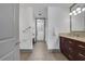 Spacious bathroom with a walk-in closet, double sink vanity and large mirrors at 4561 Olde Perimeter Way # 702, Atlanta, GA 30346