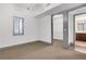 Bedroom with closet, bathroom, and shuttered windows, providing ample space and natural light at 4561 Olde Perimeter Way # 702, Atlanta, GA 30346