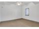 Bright bedroom with neutral carpet, ceiling fan and natural light from the shuttered windows at 4561 Olde Perimeter Way # 702, Atlanta, GA 30346