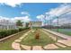 Enclosed rooftop dog park with artificial turf, landscaping and pet amenities at 4561 Olde Perimeter Way # 702, Atlanta, GA 30346