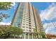 Exterior view of a high-rise building with a modern design and glass facade at 4561 Olde Perimeter Way # 702, Atlanta, GA 30346
